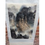 A CHINESE SCROLL PAINTING OF THREE SHIPS SAILING THROUGH A MASSIVE GORGE. 69 x 44cms.