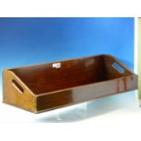 A PAIR OF ANTIQUE MAHOGANY BOOK TROUGHS, HANDLES PIERCED IN THE NARROW SIDES AND COPPER CUP