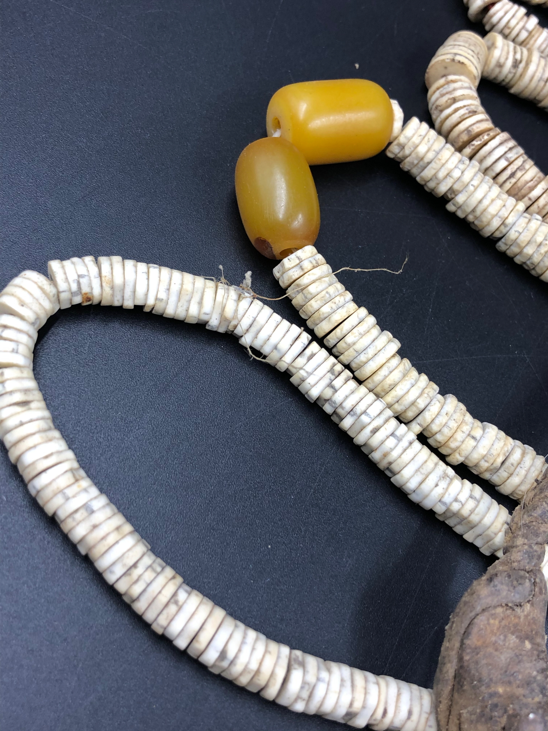 NINE STRANDS OF ETHNIC BEADED NECKLETS TO INCLUDE AMBER, BONE, IRON ETC. - Image 10 of 15