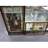 TWO MAHOGANY FRAMED LEADED GLASS PANELS, ONE OF A FIGURE WITH THE TITLE FRANCE. 99 x 66cms. THE