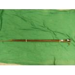 A SPIRAL TWIST GREEN GLASS WALKING STICK TOGETHER WITH A MAHOGANY WALKING CANE, THE POMMEL HANDLE