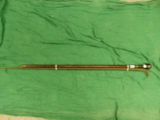 A SPIRAL TWIST GREEN GLASS WALKING STICK TOGETHER WITH A MAHOGANY WALKING CANE, THE POMMEL HANDLE