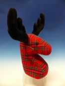 AN AS NEW NOVELTY REINDEER DOORSTOP OF TARTAN FABRIC.