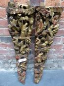 A PAIR OF CHINESE PIERCED AND CARVED GILT WOOD RED GROUND PANELS COMBINING INTO A LAPPET SHAPE AND