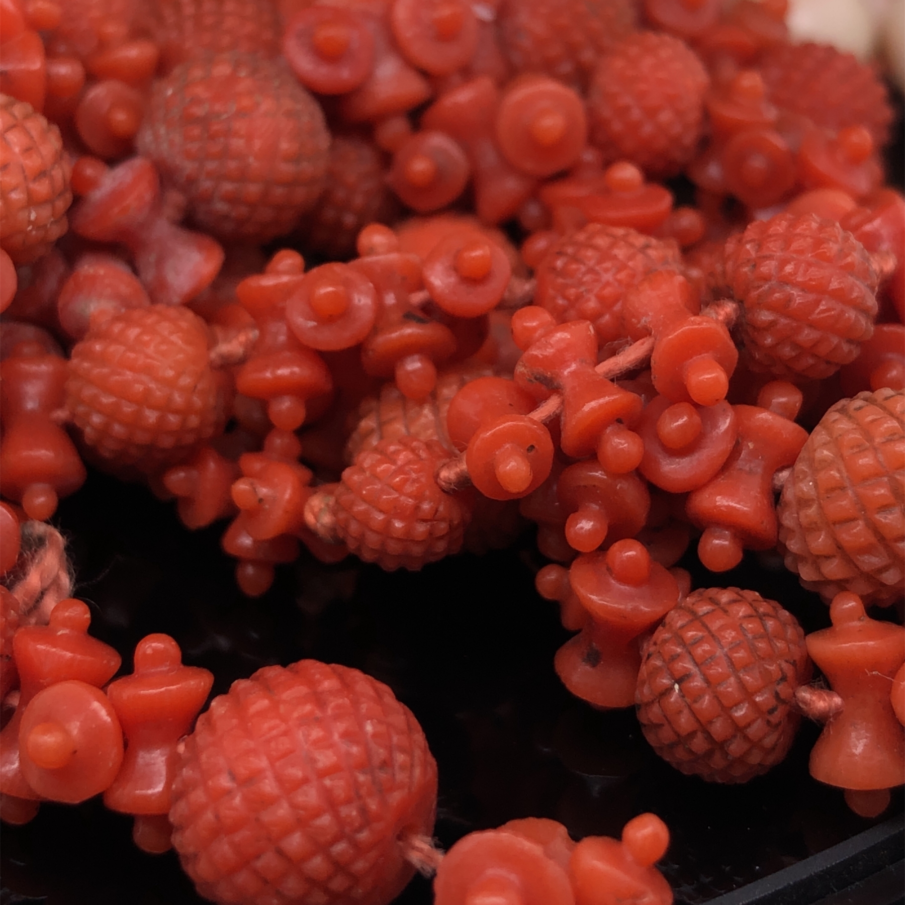 AN ANTIQUE CARVED RED CORAL ROPE OF BEADS AND SPACERS, COMPLETE WITH AN ENGRAVED BOX CLASP. APPROX - Image 2 of 31