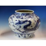 A CHINESE BLUE AND WHITE COMPRESSED SPHERICAL JAR PAINTED WITH A DRAGON CHASING A FLAMING PEARL