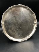 A GEORGIAN HALLMARKED SILVER THREE FOOTED SALVER, ARMORIAL ENGRAVED, DATED 1774 LONDON. DIAMETER