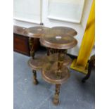 A KASHMIRI FLORAL LACQUERED TREFOIL TWO TIER TABLE WITH OPEN WORK LEGS AND DISC FEET. W 46 x D 46