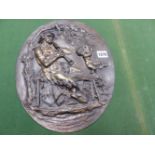 AFTER CLODION, A 19th C. BRONZE OVAL PLAQUE DEPICTING IN RELIEF A SATYR SEATED ON A BENCH WHILE