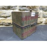 A HUNTLEY AND PALMERS BISCUIT TIN MODELLED AS EIGHT VOLUMES BY DICKENS BOUND TOGETHER BY A BELT. H