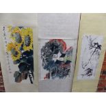 THREE CHINESE SCROLLS DEPICTING HOUSES AMONGST SPRING BLOSSOMS AND FOLIAGE. 58.5 x 43cms.