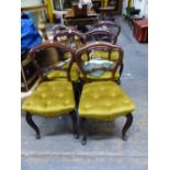 A SET OF SIX VICTORIAN ROSEWOOD BALLOON BACKED CHAIRS WITH BUTTONED GOLDEN VELVET SEATS AND CABRIOLE