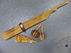 A THAI MOUTH ORGAN FORMED OF SIXTEEN BAMBOO PIPES, A SET OF BAMBOO PANS PIPES AND A PAIR OF