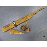 A THAI MOUTH ORGAN FORMED OF SIXTEEN BAMBOO PIPES, A SET OF BAMBOO PANS PIPES AND A PAIR OF