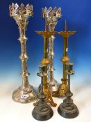 A PAIR OF NEOGOTHIC SILVERED PRICKET CANDLESTICKS. H 48.5cms. A PAIR OF PARCEL GOLD PAINTED BRASS