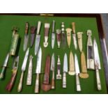 A COLLECTION OF TWELVE DAGGERS AND SHEATHS, MAINLY ARGENTINIAN TOGETHER WITH A KASHMIRI GREEN FLORAL
