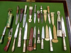 A COLLECTION OF TWELVE DAGGERS AND SHEATHS, MAINLY ARGENTINIAN TOGETHER WITH A KASHMIRI GREEN FLORAL