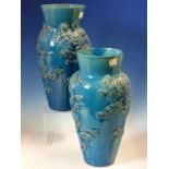 A PAIR OF 19th C. CHINESE TURQUOISE VASES, THE OVOID BODIES MOULDED IN RELIEF WITH DRAGONS AMONGST
