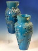 A PAIR OF 19th C. CHINESE TURQUOISE VASES, THE OVOID BODIES MOULDED IN RELIEF WITH DRAGONS AMONGST