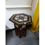 AN ISLAMIC HEXAGONAL TABLE WITH GEOMETRIC INLAY AND MOTHER OF PEARL. H. 50cms.