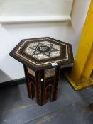 AN ISLAMIC HEXAGONAL TABLE WITH GEOMETRIC INLAY AND MOTHER OF PEARL. H. 50cms.