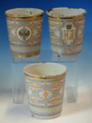 THREE ENAMEL BEAKERS COMMEMORATING THE 1896 CORONATION OF TSAR NICHOLAS II. H 10.5cms.