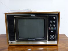 A SONY TRINITRON KV-1320UB COLOUR TELEVISION IN A BLONDE WOOD CASE WITH THE RECEIPT FROM 29/5/71.