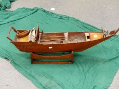 A MAHOGANY SCALE MODEL OF A CHINESE SAILING JUNK ON WOOD STAND. W 84cms.