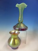 AN IRIDESCENT GLASS BALUSTER VASE, POSSIBLY WMF, THE AMBER GLASS WITH A GOLDEN GLOW. H 10.5cms.