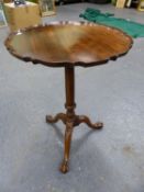 A 19th C. MAHOGANY TILT TOP TABLE, THE CIRCULAR TOP WITH PIE CRUST EDGE, THE GUN BARREL COLUMN ON