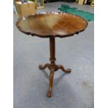 A 19th C. MAHOGANY TILT TOP TABLE, THE CIRCULAR TOP WITH PIE CRUST EDGE, THE GUN BARREL COLUMN ON