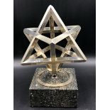 LESLIE GORDON DURBIN (1913 - 2005)- A HALLMARKED SOLID SILVER SPINNING STAR ON PLINTH AWARD, CONTA