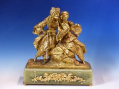 A GILT BRONZE GROUP OF A TURKISH/PERSIAN COUPLE, ARMS AROUND EACH OTHER AND LEANING ON A ROCK LOOK