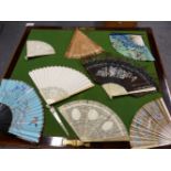 A COLLECTION OF EIGHT FANS, TO INCLUDE: FOUR WITH CARVED IVORY STICKS, THREE WITH PAINTED LEAVES AND