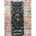 A PIERCED AND CARVED WOOD PANEL DEPICTING THE BUDDHA STANDING FLANKED BY DRAGONS. 87 x 33.5cms.