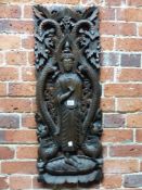 A PIERCED AND CARVED WOOD PANEL DEPICTING THE BUDDHA STANDING FLANKED BY DRAGONS. 87 x 33.5cms.