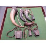 THREE COWRIE DECORATED COWS HORNS, ANOTHER UNDECORATED,A COWS HORN BELL TOGETHER WITH THREE IRON COW