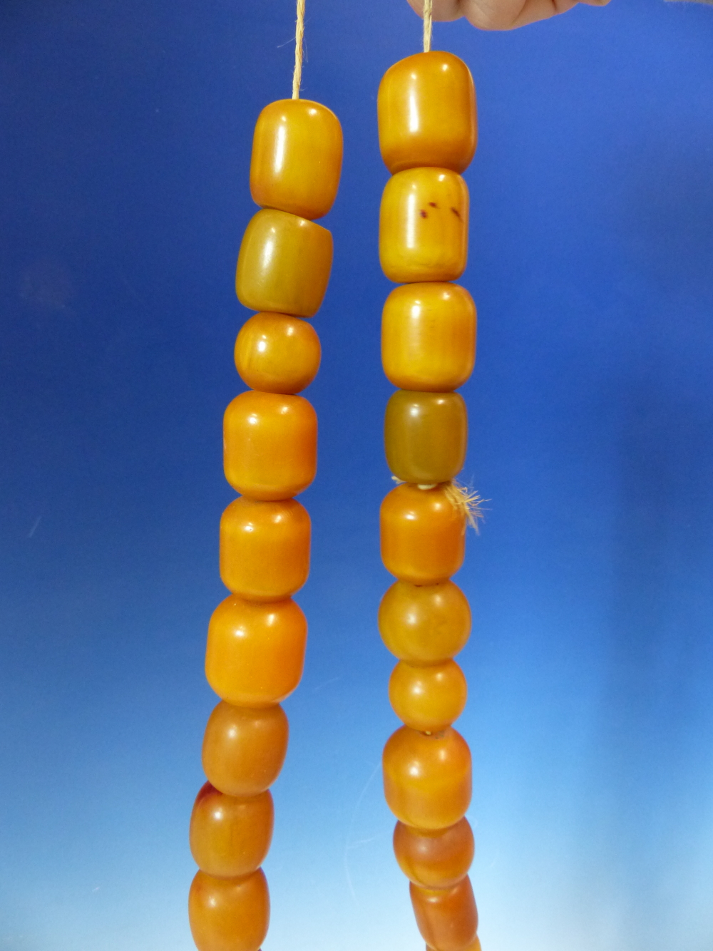 A STRING OF 27 ETHIOPIAN AMBER BEADS, PROBABLY FIRST HALF OF THE 20th.C. VARYING IN SHAPE AND - Image 2 of 4