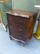 A WALNUT BEDSIDE CABINET, THE DOOR DISGUISED AS THREE SERPENTINE FRONTED DRAWERS ABOVE THE