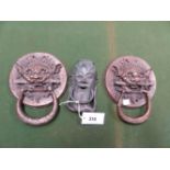 A PAIR OF BRASS LION MASK AND RING DOOR KNOCKERS, THE CIRCULAR BACK PLATES INSCRIBED. Dia. 18cms.