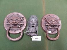A PAIR OF BRASS LION MASK AND RING DOOR KNOCKERS, THE CIRCULAR BACK PLATES INSCRIBED. Dia. 18cms.