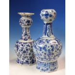 TWO 19th C. DUTCH DELFT BLUE AND WHITE ONION TOPPED VASES VARIOUSLY PAINTED WITH FLOWERS. H 29.5 AND