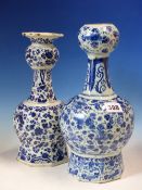 TWO 19th C. DUTCH DELFT BLUE AND WHITE ONION TOPPED VASES VARIOUSLY PAINTED WITH FLOWERS. H 29.5 AND