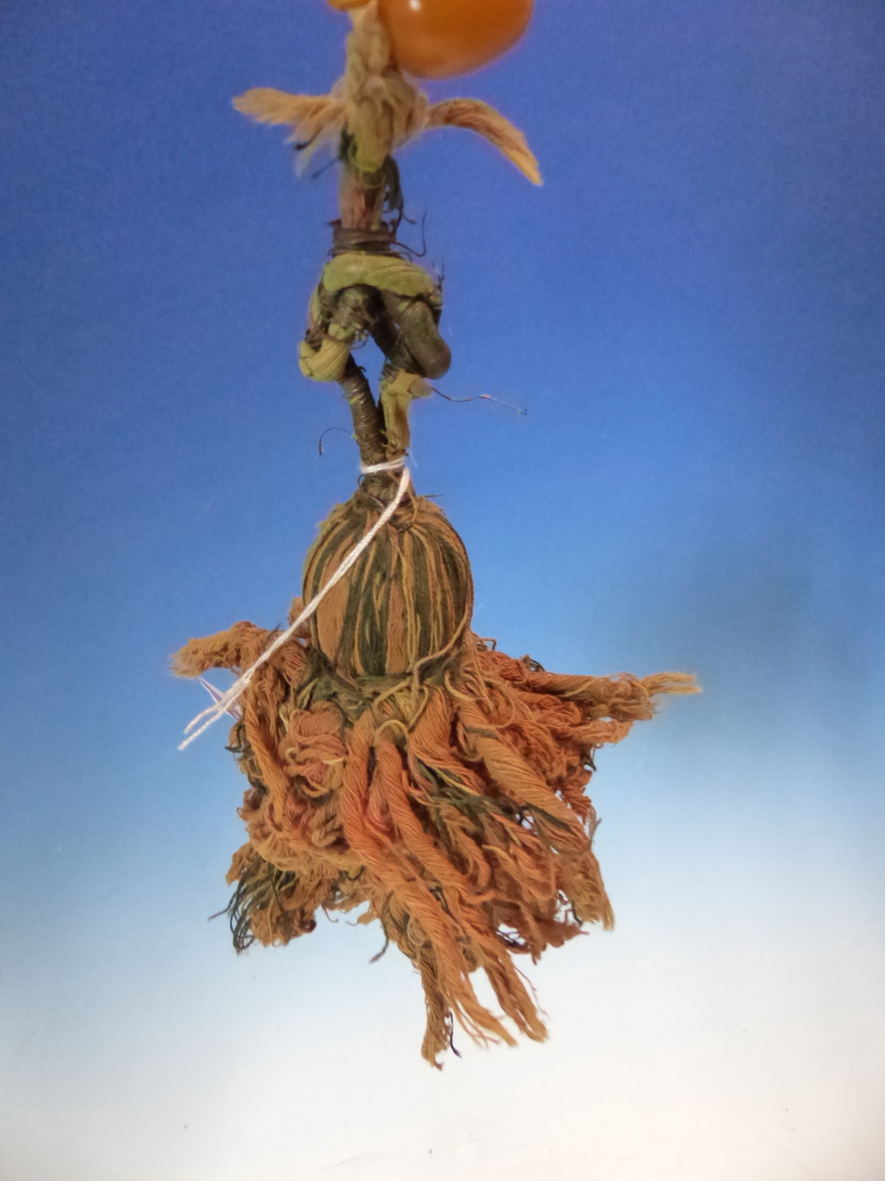 A CONTINUOUS STRING OF 80 UNIFORM OVAL ETHIOPIAN AMBER BEADS WITH KNOT TASSEL PROBABLY FIRST HALF OF - Image 6 of 7