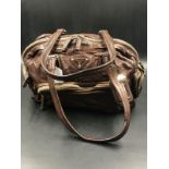 PRADA HANDBAG. A CHOCOLATE BROWN VINTAGE LEATHER HANDBAG. TAN LEATHER INTERIOR WITH ZIP POCKET,