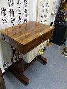 A VICTORIAN ROSEWOOD WORK TABLE, A DRAWER ABOVE THE WORK BAG BETWEEN LYRE ENDS ON PLINTHS WITH PAIRS