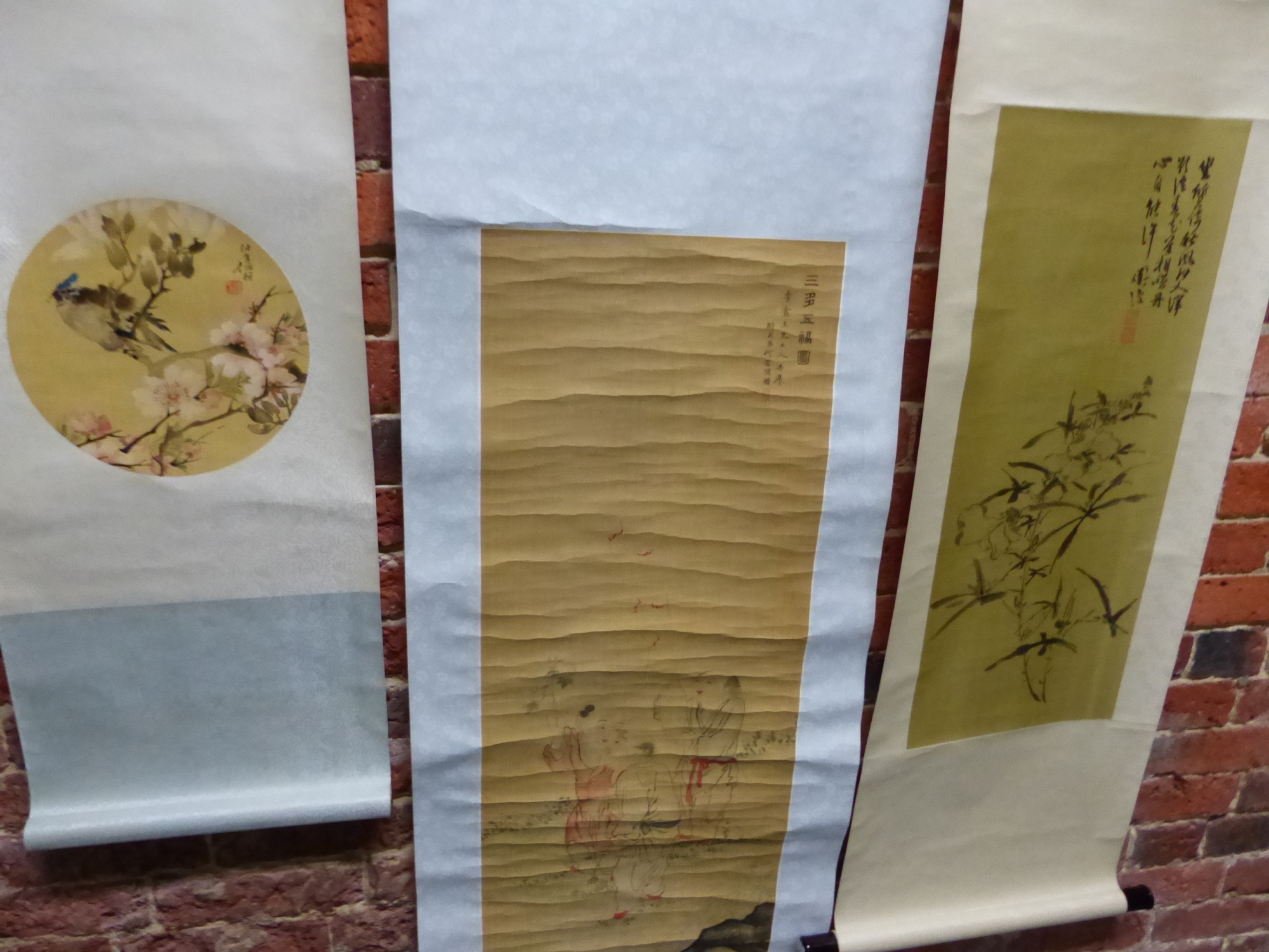 THREE CHINESE SCROLLS, ONE PRINTED WITH THREE BOYS RELEASING RED BATS. 94 x 37cms. THE SECOND WITH