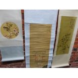 THREE CHINESE SCROLLS, ONE PRINTED WITH THREE BOYS RELEASING RED BATS. 94 x 37cms. THE SECOND WITH