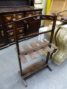 A GEORGE III MAHOGANY WHIP AND BOOT STAND. A BRASS HANDLE ABOVE THE FOUR PEGS EACH SIDE OF THE