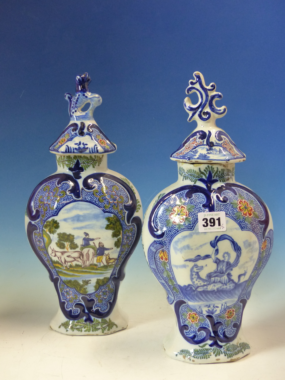 TWO 19th C. DUTCH DELFT POLYCHROME VASES AND COVERS OF FLATTENED BALUSTER SHAPE, ONE PAINTED WITH